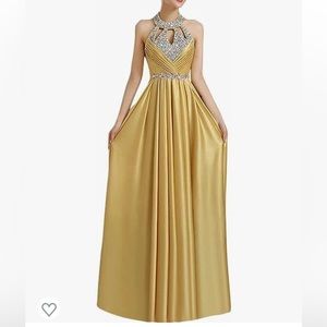 Yellow gold open back formal dress with jewels.